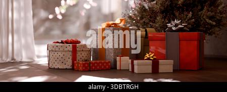 Christmas gifts under the xmas tree at the morning. Beautiful boxes on floor in living room. Stock Photo