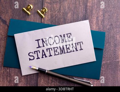 Business and economy concept. There are two notebooks and a pencil on the table. On the top notepad, the inscription - Interest Expense Stock Photo