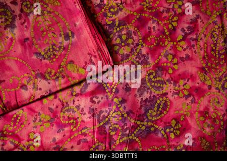Pure cotton sarees in red, blue, orange and green colors with traditional Indian textile patterns Stock Photo