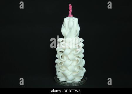 Elegant handcrafted carved candle made from layered white wax design Stock Photo