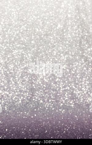 Abstract background with a soft gradient of burgundy-gray tones, saturated with shimmering particles of glitter. Stock Photo