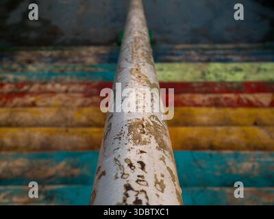 Close-up of Worn Handrail and Colorful Peeling Paint on Weathered Stairs in Istanbul Stock Photo