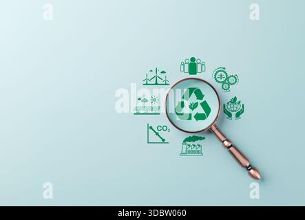 Renewable Energy and Sustainability Planning Concept. Magnifying glass focuses on green recycle icon represent renewable energy, low emissions, enviro Stock Photo