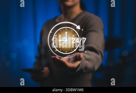 24/7 Customer Support and Availability Service Concept. Woman holding glowing 24/7 clock icon, round clock customer service, continuous Stock Photo