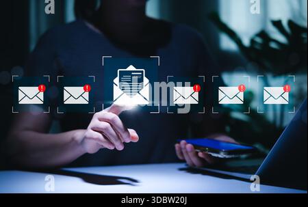 New Email Notification interaction Concept. Person interacts with email icons featuring alert symbols, representing incoming messages, email security Stock Photo