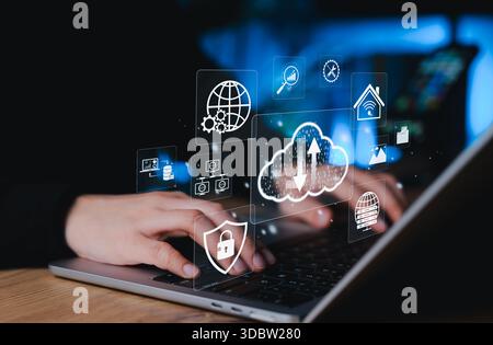 Cloud Computing and Data Security Technology Concept. Laptop with icons of cloud storage, security shield, database, IoT, and global connectivity, Stock Photo