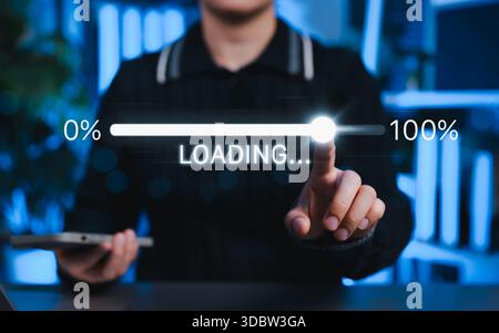 Technology Progress and Digital Loading Bar Concept. Person interacts with loading bar progressing from 0% to 100%, representing software updates, Stock Photo