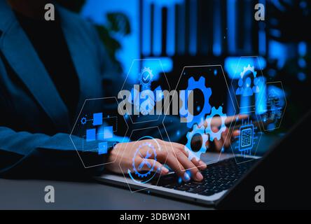 BPA Business process automation concept. A professional using laptop with digital icons of gear, flowcharts, cloud computing, tools, Stock Photo