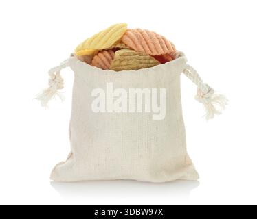 Open cotton pouch filled with assorted vegetable chips, isolated on a transparent background, full focus stacking for sharp texture and clear detail Stock Photo