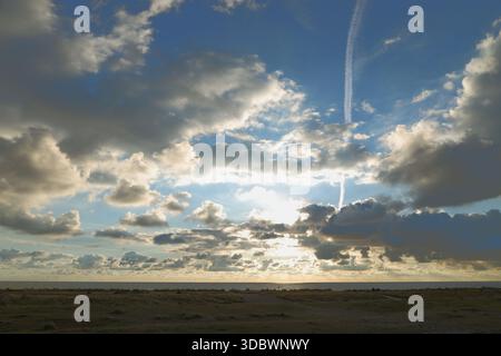 Kessingland village, Suffolk, England, UK - Dramatic sky over the North Sea viewed from Kessingland beach at sunrise Stock Photo