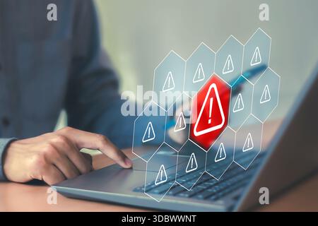 Cybersecurity concept shows warning symbols on screen, system malfunctions and threat detection technology. Stock Photo