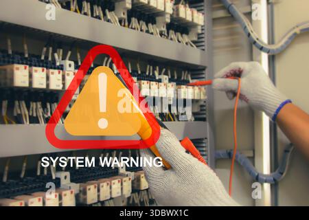 Technicians use multimeter to test or diagnose electrical control devices. Stock Photo