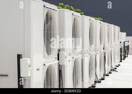 Air conditioning (HVAC) installed on the roof of industrial buildings. Stock Photo