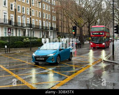 London, UK. 18 December 2025. Pedestrians use umbrellas as traffic moves through rain-soaked streets in central London following heavy downpours. Wet roads and reflections are seen during unsettled weather in the capital. Credit: Alexander Seale/Ģ����ý Live News Stock Photo
