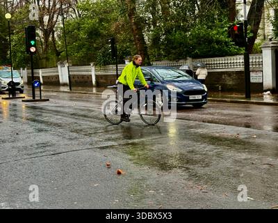 London, UK. 18 December 2025. Pedestrians use umbrellas as traffic moves through rain-soaked streets in central London following heavy downpours. Wet roads and reflections are seen during unsettled weather in the capital. Credit: Alexander Seale/Ģ����ý Live News Stock Photo