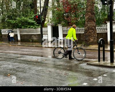 London, UK. 18 December 2025. Pedestrians use umbrellas as traffic moves through rain-soaked streets in central London following heavy downpours. Wet roads and reflections are seen during unsettled weather in the capital. Credit: Alexander Seale/Ģ����ý Live News Stock Photo