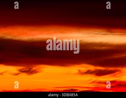 Sunset sky with dramatic swirling clouds and vibrant colors – ideal nature background for commercial design Abstract Orange Red Gradient Stock Photo