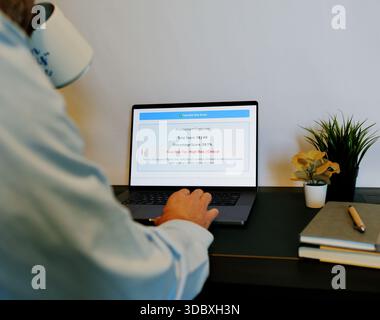 Middle Aged Male Cybersecurity Analyst Conducts Third Party Risk Assessment on Outside Vendor Stock Photo