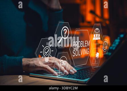 Problem solving strategy in business and technology with a person working on laptop, surrounded by icons for solution finding, troubleshooting, Stock Photo