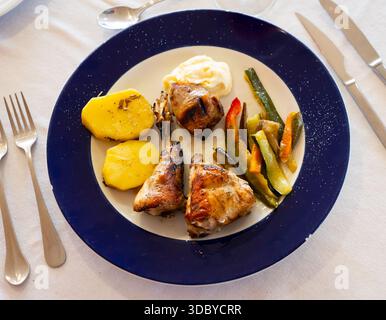 Roasted rabbit served with vegetable garnish Stock Photo