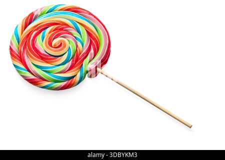 Colorful rainbow lollipop swirl on wooden stick isolated on white backgroun Stock Photo