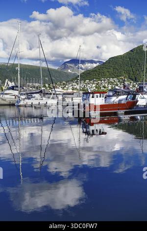Harbour view with boats and reflections in the water, Tromso Stock Photo
