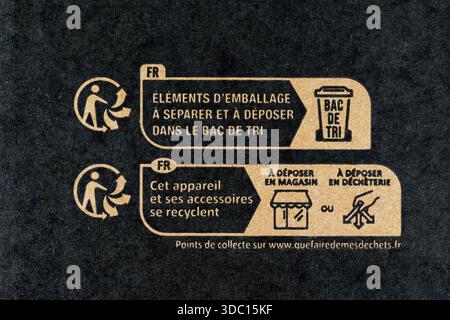 French recycling "La Triman" logo/symbol on a cardboard box with information on where to recycle packaging and materials. Stock Photo