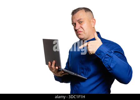 Man gesturing approval while holding laptop, success and positive feedback Stock Photo