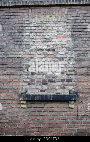 closed window in a brick wall Stock Photo