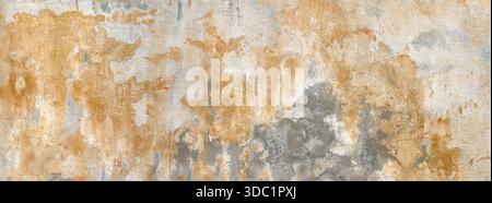Aged concrete wall revealing damaged plaster and peeling paint creating a grunge surface Stock Photo