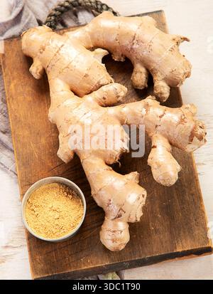 Fresh ginger on a light background. Dry ginger. Sliced ​​ginger, ginger root. Top view. Traditional alternative medicine for immunity. Stock Photo