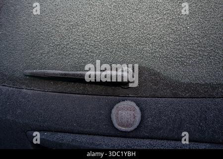Ice frozen on the roof and window of a car Stock Photo