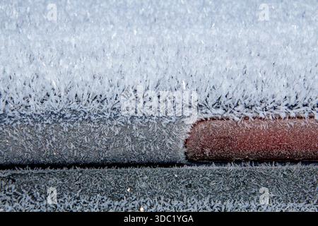 Ice frozen on the roof and window of a car Stock Photo