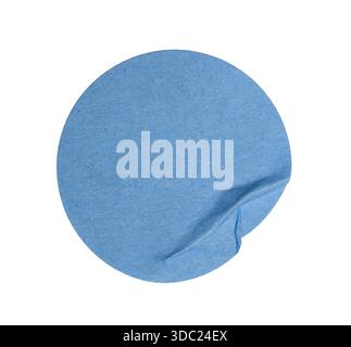 Blue circular paper sticker showing wrinkles and texture. Transparent background offering ample copy space for text, price, or branding Stock Photo
