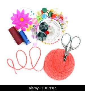 A vibrant collection of sewing essentials including yarn, buttons, and scissors arranged on white. Perfect for craft blogs, DIY tutorials, Stock Photo