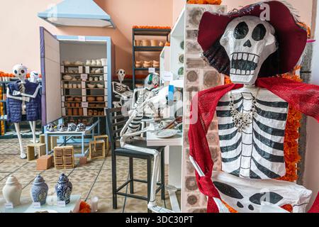 Puebla Mexico,Day of the Dead display,Dia de Muertos,skeleton figures,art installation,traditional culture,handmade crafts,interior exhibit,folk art,h Stock Photo