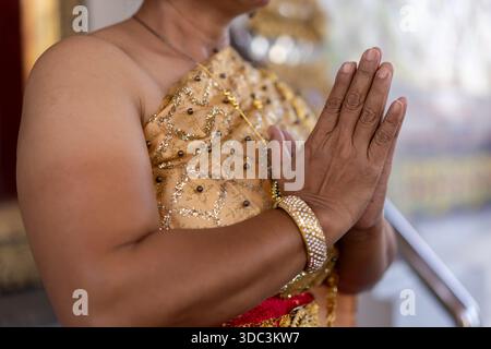 Close up of elderly womans hands, doing the traditional thai hand greetings. High quality photo Stock Photo