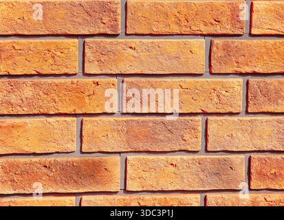 Orange Brick Wall Texture with Rectangular Pattern for Modern Architectural and Construction Design Copy Space Background Stock Photo