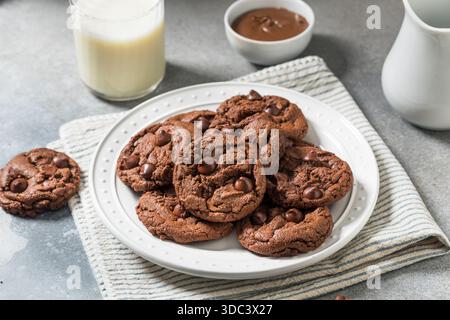 Homemade Double Chocolate Chip Hazelnut Cookies with Milk Stock Photo