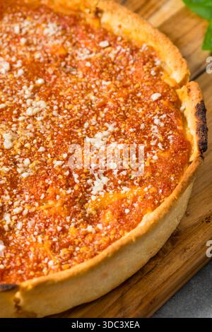 Homemade Chicago Style Deep Dish Pizza with Sauce and Cheese Stock Photo
