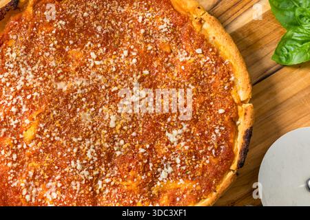 Homemade Chicago Style Deep Dish Pizza with Sauce and Cheese Stock Photo