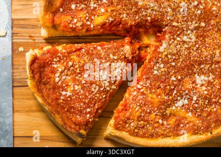 Homemade Chicago Style Deep Dish Pizza with Sauce and Cheese Stock Photo