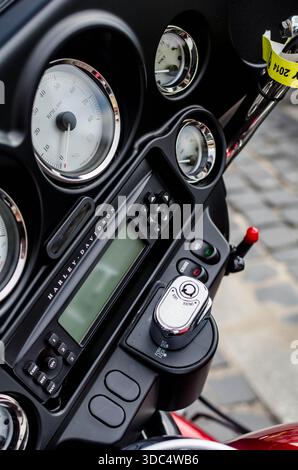 Harley-Davidson instrument cluster close-up with ignition and control switches at Warsaw rally. Stock Photo