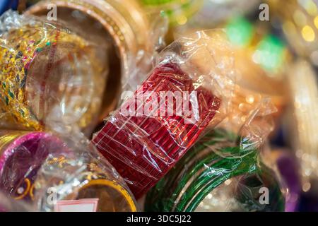 Colorful Neon Bangles In Clear Box – Bright Craft Jewelry Storage For Accessories Enthusiasts Stock Photo