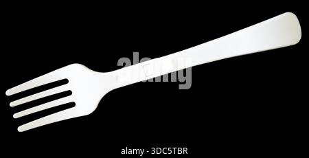 Plastic fork isolated on black background Stock Photo