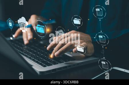 DMS Document Management System concept. Data storage. Businessman using a tablet and touching folder icon to search on databases with virtual screen. Stock Photo