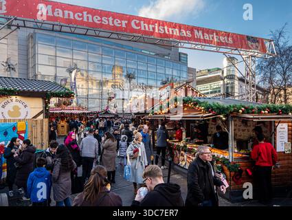 Manchester, UK. 20th Dec, 2025. Christmas Market in front of Selfridges store in Exchange Square. A stark contrast between packed Christmas markets and busy shops in Manchester city centre as temperatures drop with homeless rough sleepers facing a festive season on the streets. Manchester UK Picture: garyrobertsphotography Credit: GaryRobertsphotography/Alamy Live News Stock Photo