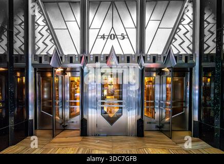 New York, NY - US - Dec 13, 2025 The Chrysler Building’s elegant Art Deco revolving doors at 405 building entrance with geometric glass panels and pol Stock Photo