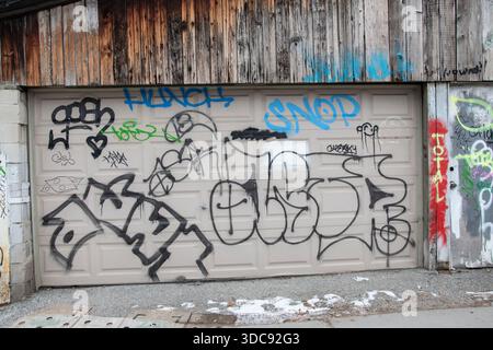 graffiti-tagged-on-a-garage-