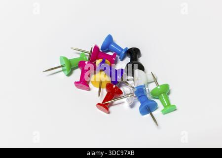 Colorful drawing pins with metal tips on white background, Germany Stock Photo